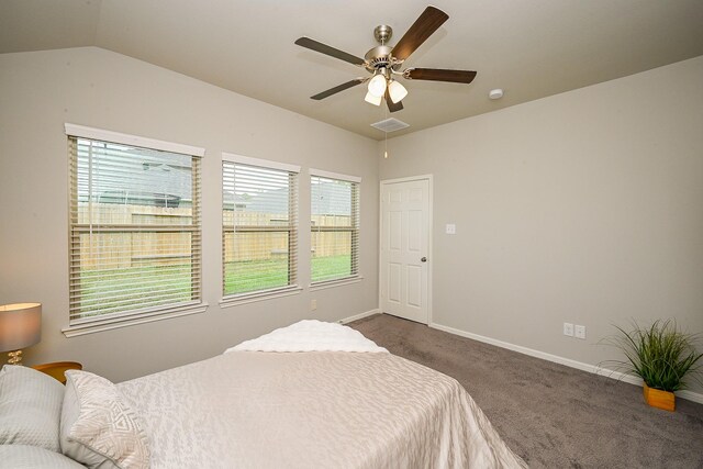 10130 Barn Owl Trl, Magnolia, TX 77354 - bedroom featuring carpet flooring, multiple windows, baseboards, and lofted ceiling