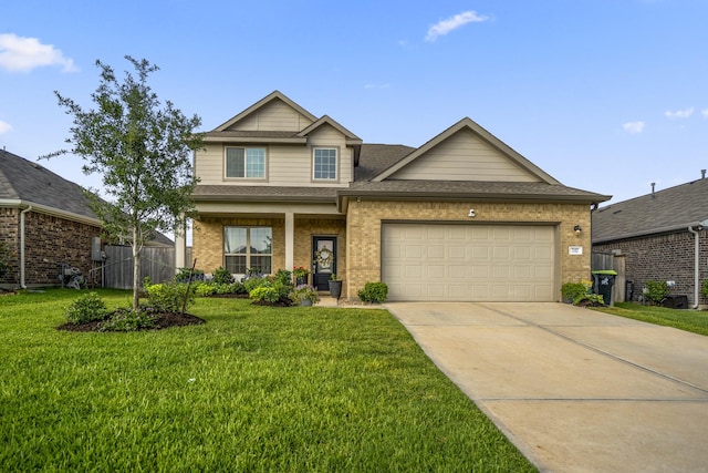717 Rumple Elm Rd, Magnolia, TX 77354 - view of front facade featuring a garage, concrete driveway, a shingled roof, and brick siding