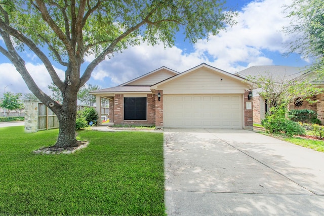 1803 Fallow Ln, Houston, TX 77049 - single story home with a garage, driveway, brick siding, and a front lawn