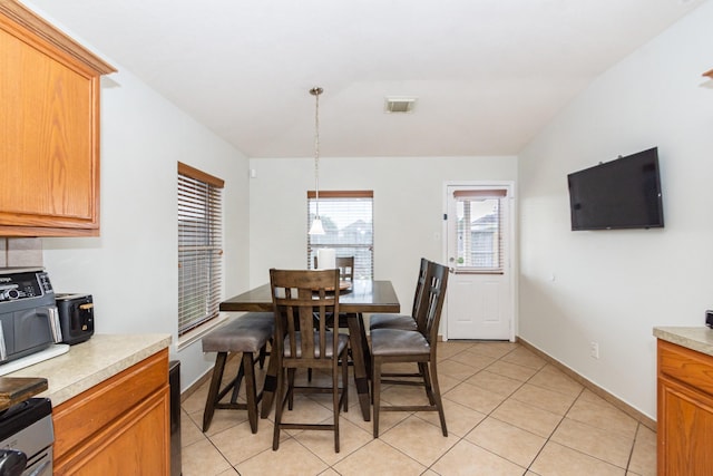 1803 Fallow Ln, Houston, TX 77049 - dining room featuring light tile patterned floors and baseboards