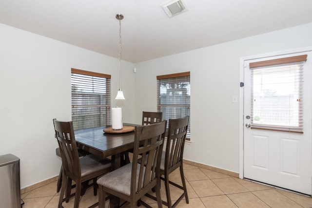 1803 Fallow Ln, Houston, TX 77049 - dining area featuring healthy amount of natural light, light tile patterned flooring, and baseboards