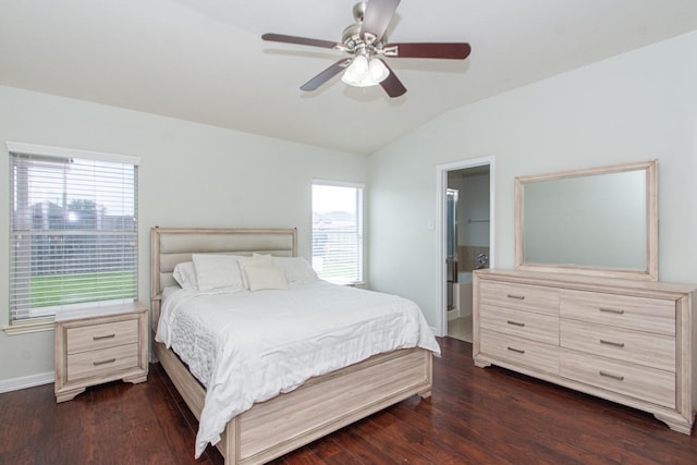 1803 Fallow Ln, Houston, TX 77049 - bedroom featuring vaulted ceiling, multiple windows, dark wood-style floors, and baseboards