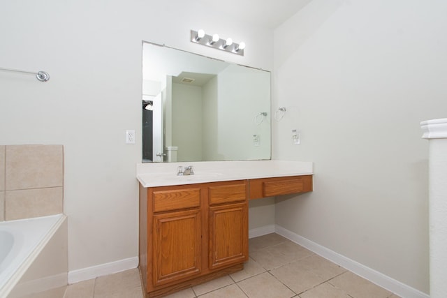 1803 Fallow Ln, Houston, TX 77049 - bathroom featuring tile patterned flooring, a bath, vanity, and baseboards