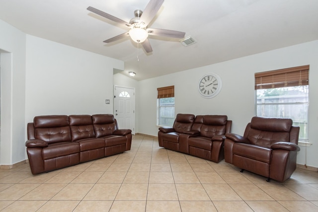 1803 Fallow Ln, Houston, TX 77049 - living room featuring a ceiling fan, lofted ceiling, light tile patterned flooring, and plenty of natural light