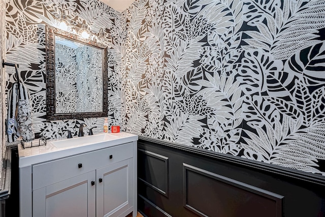 536 Rutland Pl, Houston, TX 77007 - bathroom with wallpapered walls, vanity, and a wainscoted wall