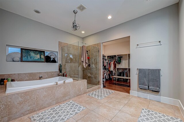 536 Rutland Pl, Houston, TX 77007 - full bath with a bath, a shower stall, tile patterned floors, a walk in closet, and recessed lighting