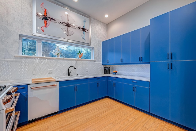 536 Rutland Pl, Houston, TX 77007 - kitchen with dishwasher, blue cabinets, a sink, high end stainless steel range, and recessed lighting