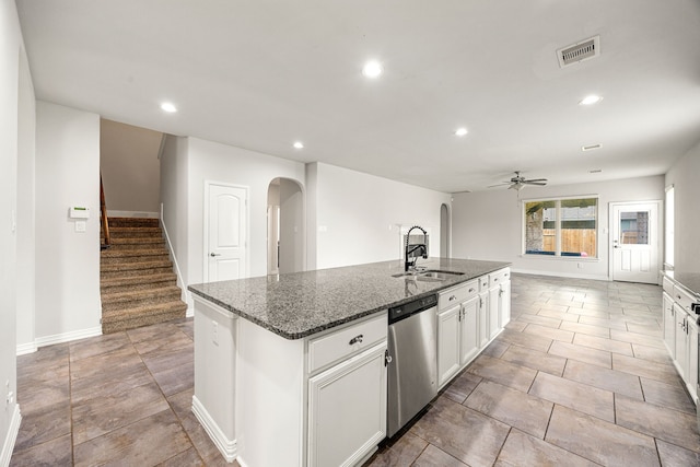 12510 Sherborne Castle Ct, Tomball, TX 77375 - kitchen with stainless steel dishwasher, a sink, arched walkways, a ceiling fan, and recessed lighting
