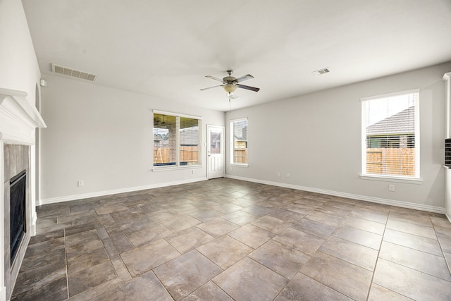 12510 Sherborne Castle Ct, Tomball, TX 77375 - unfurnished living room featuring ceiling fan, plenty of natural light, a fireplace, and baseboards