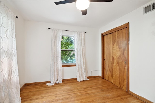 1219 Candlelight Ln, Houston, TX 77018 - unfurnished bedroom featuring light wood-style floors, ceiling fan, and baseboards