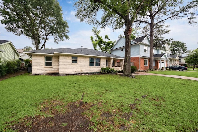 1219 Candlelight Ln, Houston, TX 77018 - view of front of home featuring a front lawn, stone siding, and concrete driveway