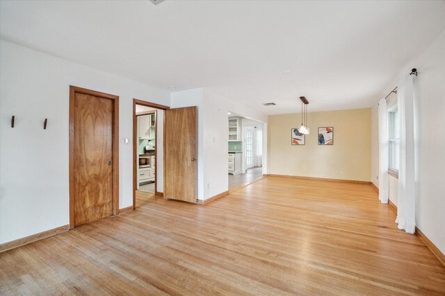 1219 Candlelight Ln, Houston, TX 77018 - spare room with light wood-style flooring and baseboards
