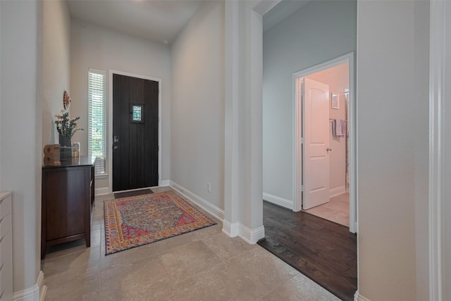 18526 Waterfall Creek Way, Cypress, TX 77429 - entrance foyer featuring decorative columns, tile patterned flooring, and baseboards