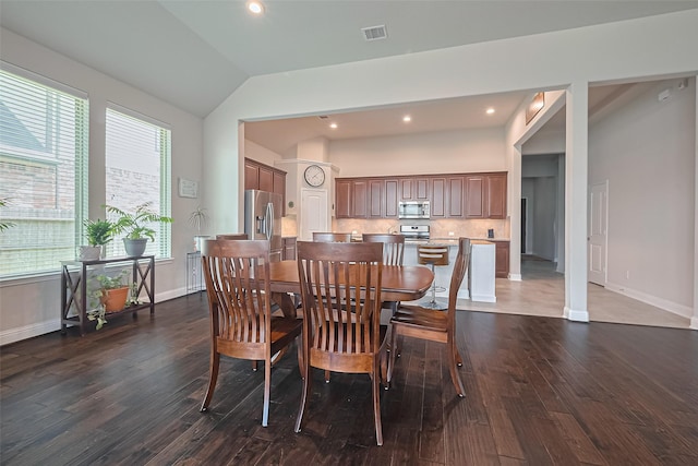 18526 Waterfall Creek Way, Cypress, TX 77429 - dining room featuring dark wood finished floors, lofted ceiling, recessed lighting, and baseboards