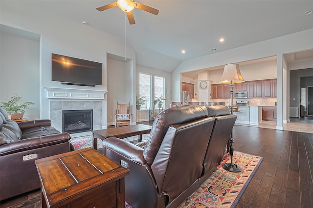 18526 Waterfall Creek Way, Cypress, TX 77429 - living area featuring a ceiling fan, dark wood-type flooring, a tile fireplace, and recessed lighting