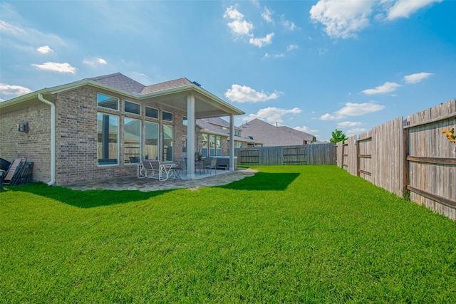 18526 Waterfall Creek Way, Cypress, TX 77429 - rear view of house with a patio and brick siding
