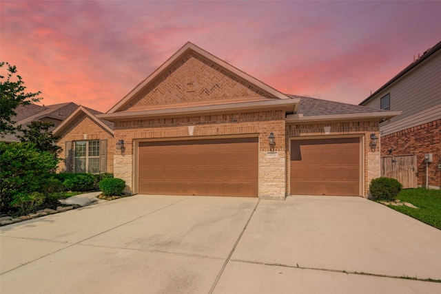18526 Waterfall Creek Way, Cypress, TX 77429 - view of front of home featuring brick siding, a garage, and driveway