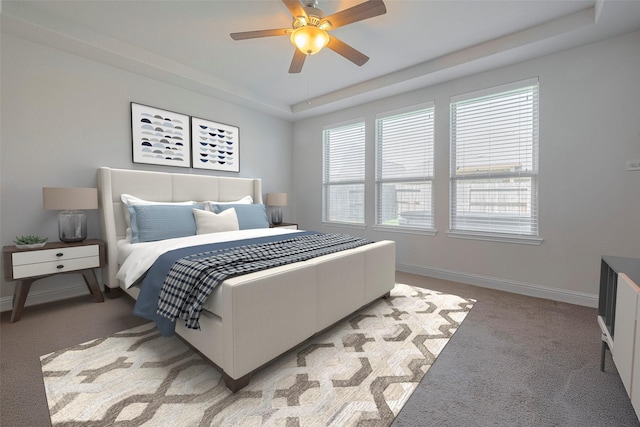 18526 Waterfall Creek Way, Cypress, TX 77429 - bedroom with light colored carpet, a raised ceiling, and a ceiling fan