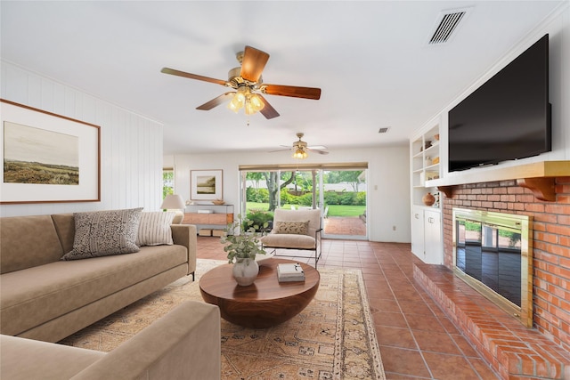 1908 Oak Shadows St, Baytown, TX 77520 - living area with a brick fireplace, dark tile patterned flooring, ceiling fan, and built in features