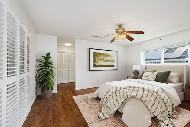 1908 Oak Shadows St, Baytown, TX 77520 - bedroom with dark wood-style flooring, a closet, baseboards, and a ceiling fan