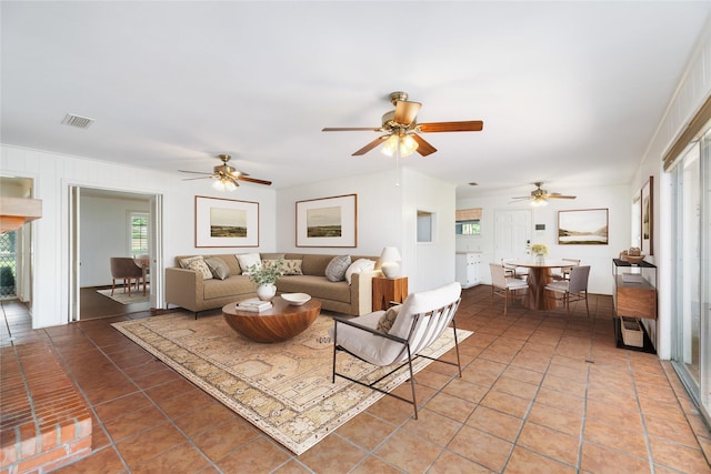 1908 Oak Shadows St, Baytown, TX 77520 - living area with light tile patterned flooring and a ceiling fan