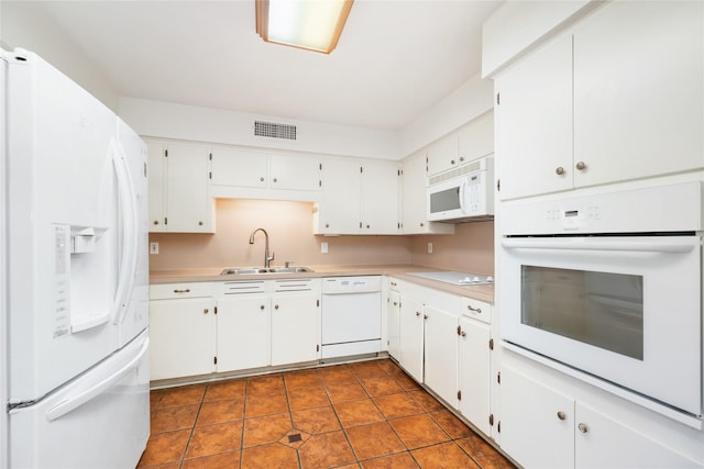 1908 Oak Shadows St, Baytown, TX 77520 - kitchen with white appliances, a sink, light countertops, and white cabinets
