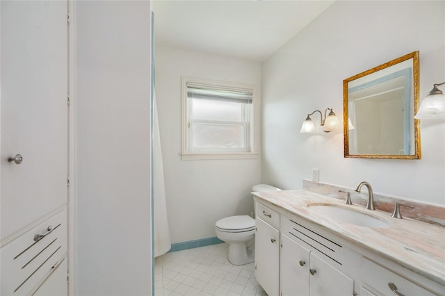 1908 Oak Shadows St, Baytown, TX 77520 - full bath featuring vanity, tile patterned floors, toilet, and baseboards