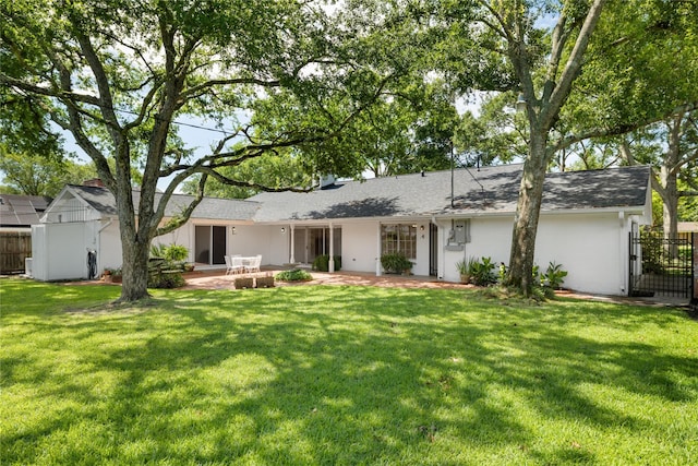 1908 Oak Shadows St, Baytown, TX 77520 - back of house with a patio, stucco siding, and a shingled roof