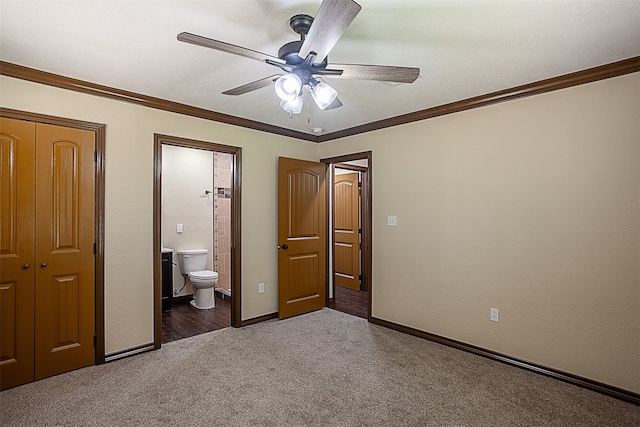 105A Butler Rd, Vidor, TX 77662 - unfurnished bedroom featuring carpet flooring, a closet, ensuite bathroom, ornamental molding, and ceiling fan