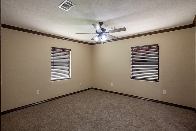 105A Butler Rd, Vidor, TX 77662 - unfurnished room featuring crown molding, ceiling fan, carpet flooring, a textured ceiling, and baseboards