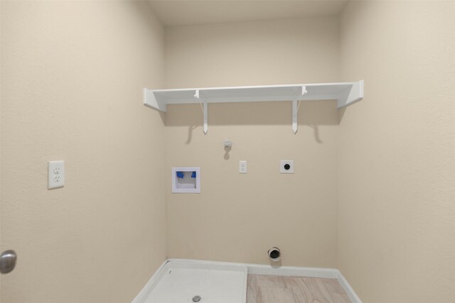 7754 Ave J, Houston, TX 77012 - washroom featuring hookup for a washing machine, gas dryer hookup, electric dryer hookup, and baseboards