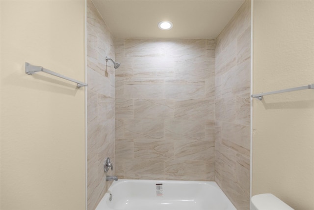7754 Ave J, Houston, TX 77012 - bathroom featuring bathing tub / shower combination, toilet, and recessed lighting