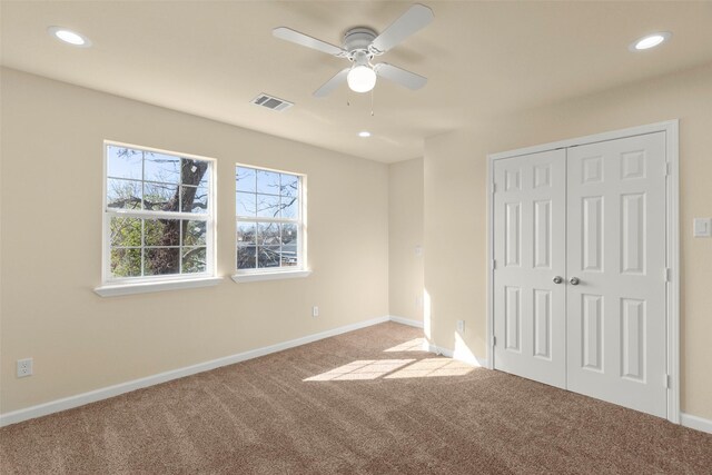 7754 Ave J, Houston, TX 77012 - unfurnished bedroom featuring carpet floors, recessed lighting, a closet, baseboards, and ceiling fan