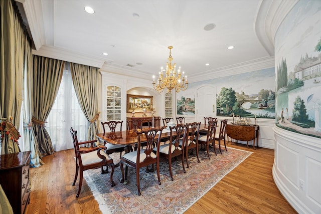 10911 Kemwood Dr, Houston, TX 77024 - dining area with crown molding, a chandelier, light wood-style flooring, recessed lighting, and a wainscoted wall