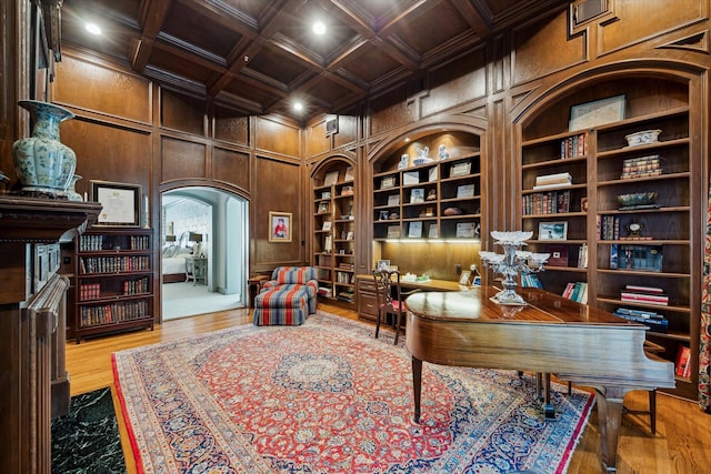10911 Kemwood Dr, Houston, TX 77024 - office area with built in shelves, a decorative wall, recessed lighting, wood finished floors, and arched walkways
