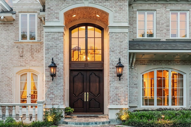 10911 Kemwood Dr, Houston, TX 77024 - view of exterior entry with french doors and brick siding
