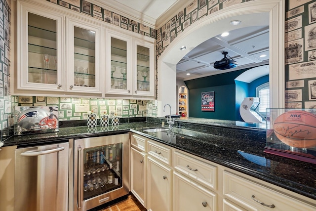 10911 Kemwood Dr, Houston, TX 77024 - indoor wet bar featuring wine cooler, recessed lighting, tasteful backsplash, and coffered ceiling