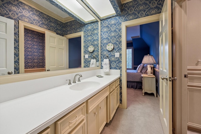 10911 Kemwood Dr, Houston, TX 77024 - ensuite bathroom with wallpapered walls and vanity
