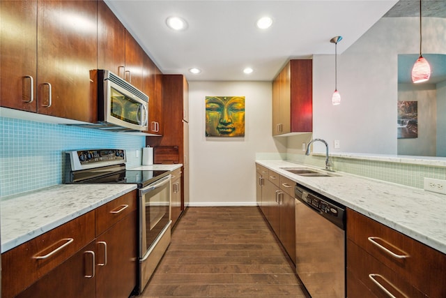 5925 Almeda Rd Unit 12314, Houston, TX 77004 - kitchen featuring appliances with stainless steel finishes, a sink, dark wood-type flooring, tasteful backsplash, and recessed lighting