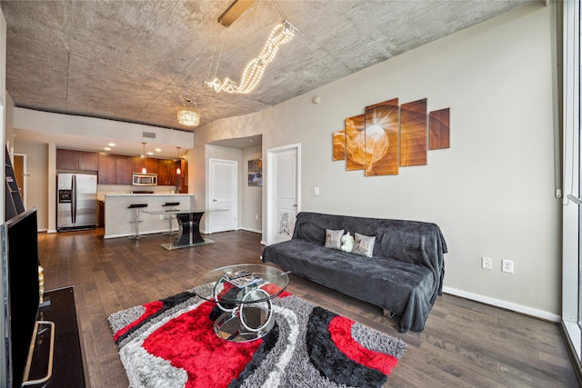 5925 Almeda Rd Unit 12314, Houston, TX 77004 - living area with dark wood-style flooring, a chandelier, and baseboards