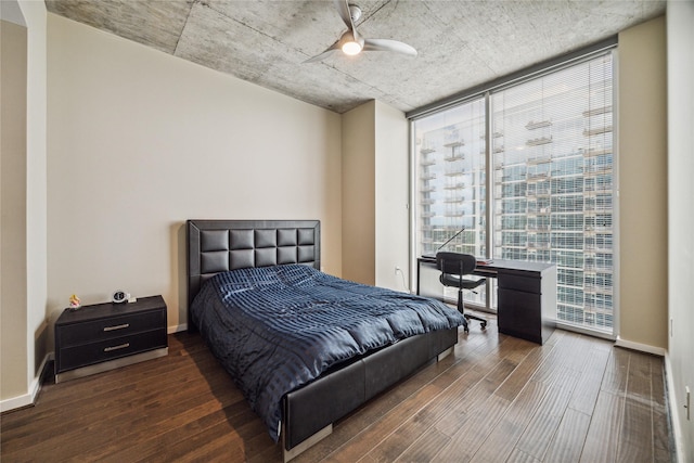 5925 Almeda Rd Unit 12314, Houston, TX 77004 - bedroom featuring a wall of windows, wood finished floors, baseboards, and a ceiling fan
