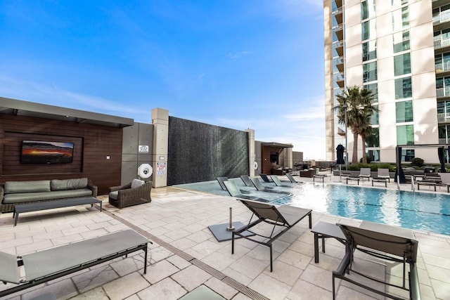 5925 Almeda Rd Unit 12314, Houston, TX 77004 - community pool featuring an outdoor hangout area and a patio area