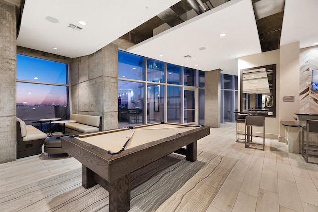 5925 Almeda Rd Unit 12314, Houston, TX 77004 - game room with billiards table, a wall of windows, and wood finished floors