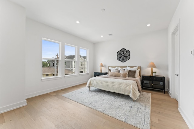 819 Dorothy St Unit B, Houston, TX 77008 - bedroom with light wood-style floors, baseboards, and recessed lighting