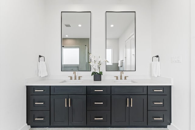 819 Dorothy St Unit B, Houston, TX 77008 - bathroom featuring double vanity and baseboards