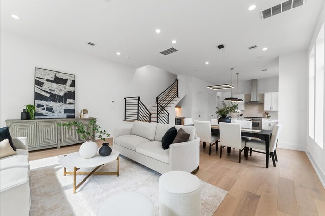 819 Dorothy St Unit B, Houston, TX 77008 - living area featuring light wood-style floors, recessed lighting, and stairway