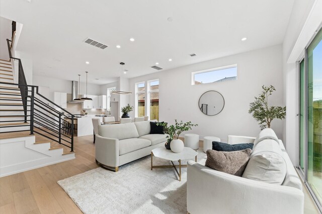 819 Dorothy St Unit B, Houston, TX 77008 - living room with plenty of natural light, stairs, wood finished floors, and recessed lighting