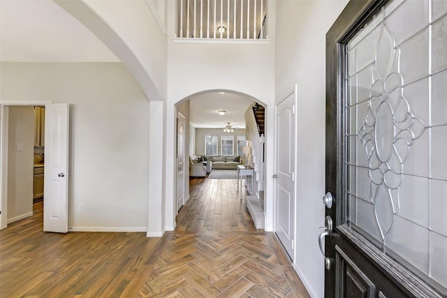 13823 Pointed Edge Ln, Cypress, TX 77429 - foyer entrance featuring ceiling fan, arched walkways, baseboards, and wood finished floors