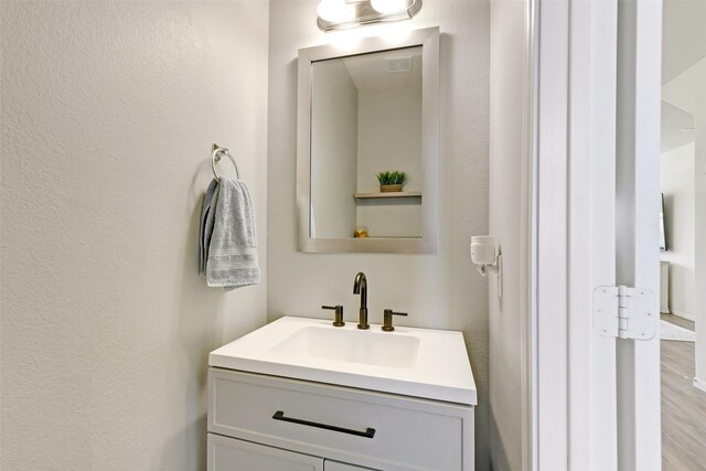 13823 Pointed Edge Ln, Cypress, TX 77429 - bathroom featuring vanity and a textured wall