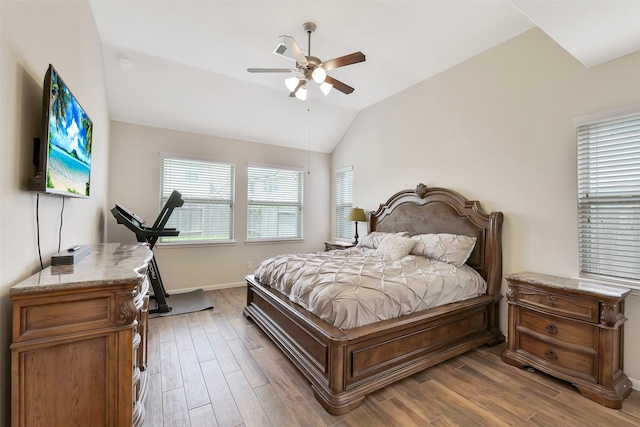 13823 Pointed Edge Ln, Cypress, TX 77429 - bedroom featuring baseboards, lofted ceiling, wood finished floors, and a ceiling fan